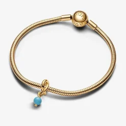 Charm Pendant doré avec cristal bleu capri